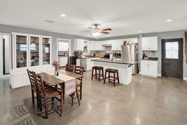 16033 Door Key Road San Angelo, TX 76904 - Photo 24 of 100 a view of a dining room with furniture and a chandelier