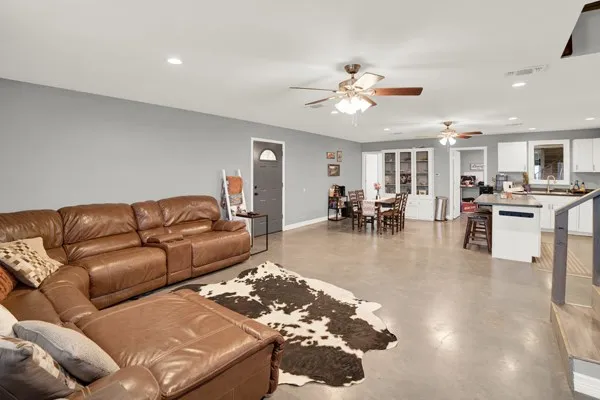 a bedroom with a bed and a couch