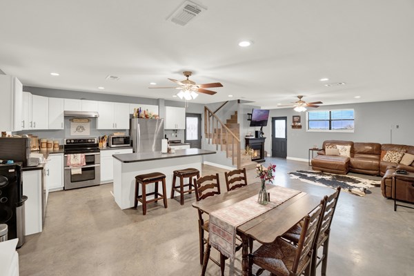 16033 Door Key Road San Angelo, TX 76904 - Photo 28 of 100 a large kitchen with a table and chairs in it