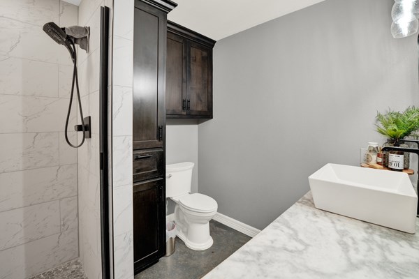 16033 Door Key Road San Angelo, TX 76904 - Photo 30 of 100 a bathroom with a sink toilet and shower