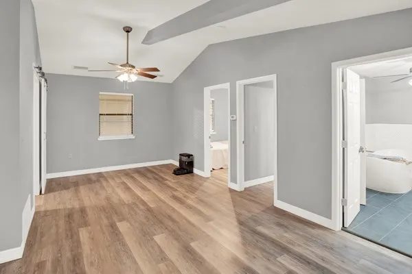 a view of a room with wooden walls