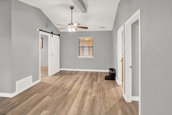 16033 Door Key Road San Angelo, TX 76904 - Photo 35 of 100 wooden floor in an empty room with a window