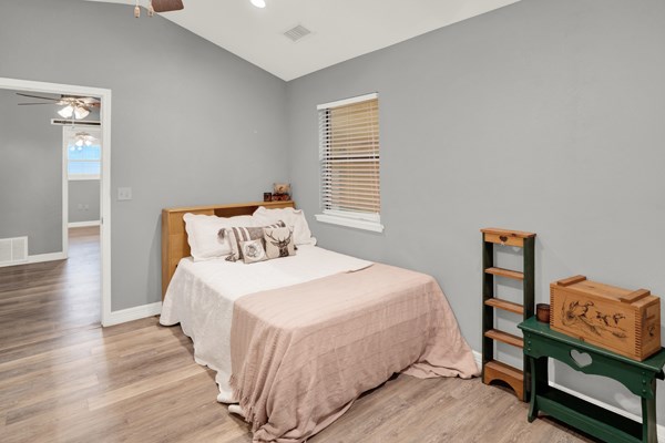 16033 Door Key Road San Angelo, TX 76904 - Photo 40 of 100 a bedroom with a bed and wooden floor