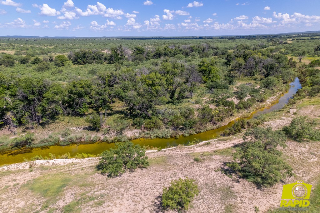 16033 Door Key Road San Angelo, TX 76904 - Photo 86 of 100 a view of a yard with a lake view