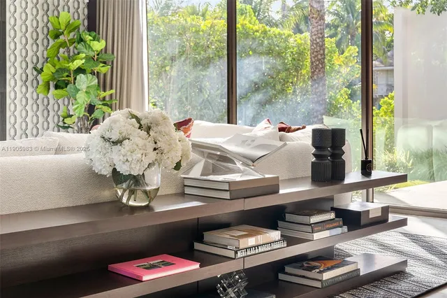 a living room with furniture fireplace and a view of kitchen