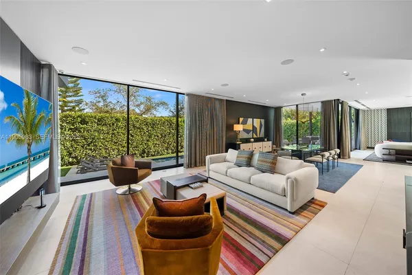 a kitchen with stainless steel appliances granite countertop a lot of counter space and wooden floors