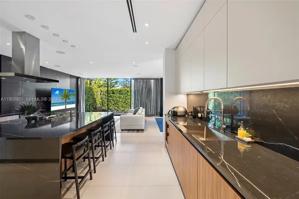 a bathroom with a sink vanity mirror and toilet