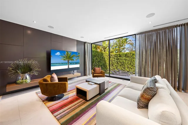 a room with furniture and a large window