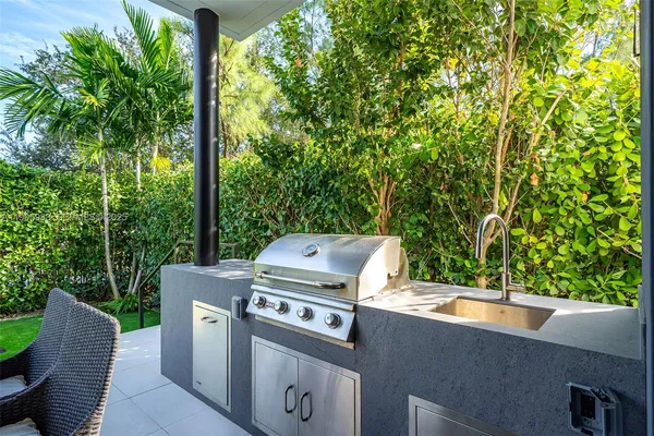 a bathroom with a bathtub sink and mirror
