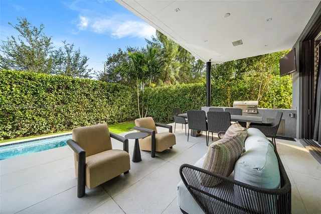 a view of a chairs and table in the garden