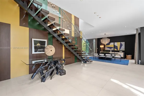 a living room with furniture and a garden