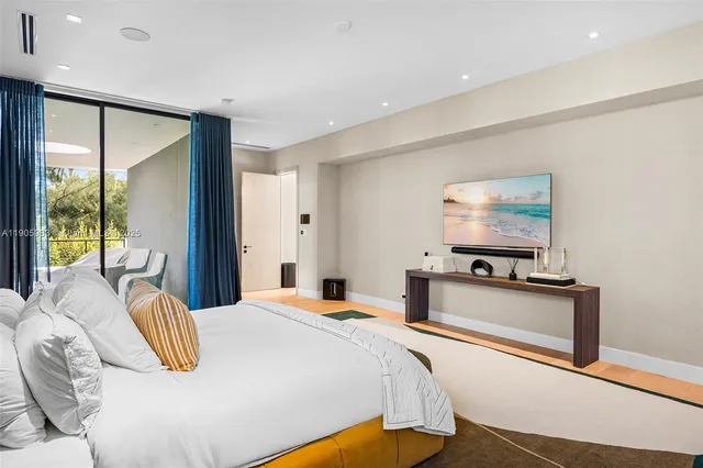 a bedroom with a bed and a painting on the wall