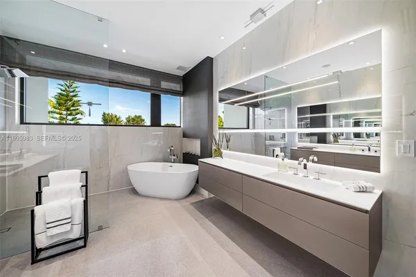 a white bath tub sitting in a bathroom