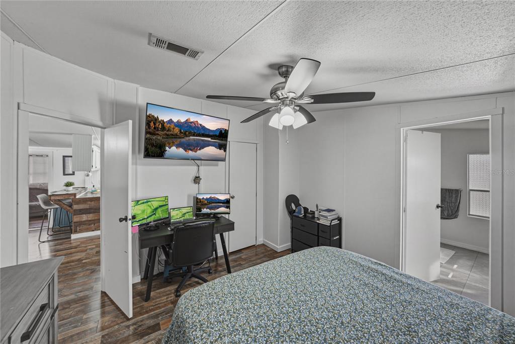 4695 Turner Road Mulberry, FL 33860 - Photo 27 of 51 a bedroom with a bed and a flat screen tv