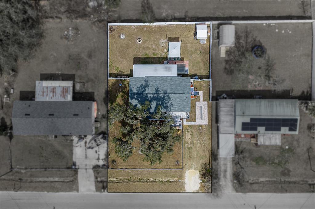 4695 Turner Road Mulberry, FL 33860 - Photo 3 of 51 an aerial view of a house with a garden