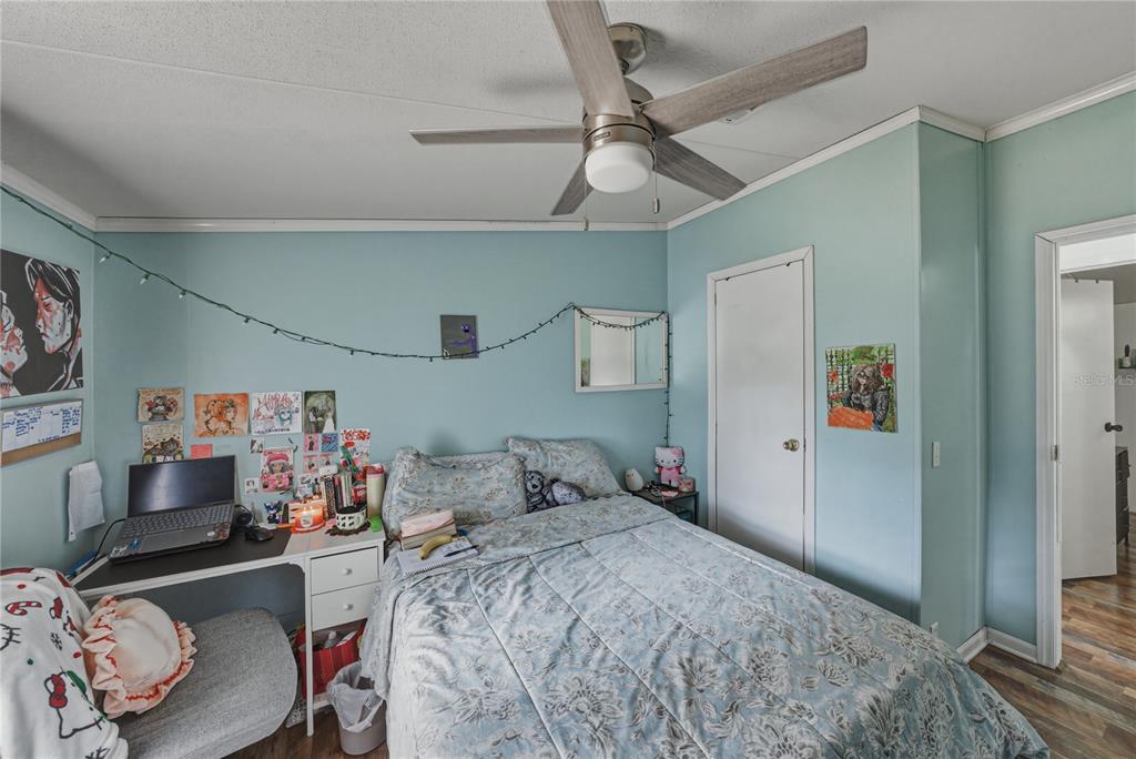 4695 Turner Road Mulberry, FL 33860 - Photo 35 of 51 a bedroom with a bed and a tv