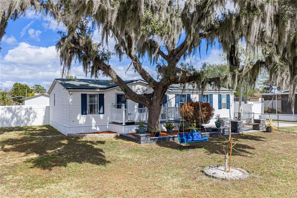 4695 Turner Road Mulberry, FL 33860 - Photo 4 of 51 a swimming pool with outdoor seating and yard