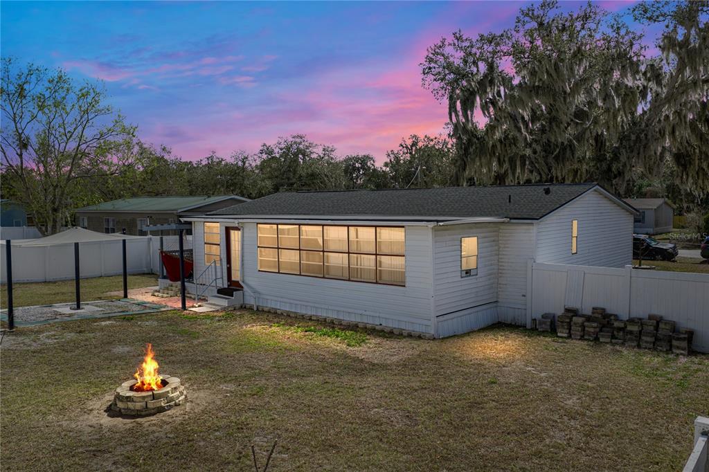 4695 Turner Road Mulberry, FL 33860 - Photo 42 of 51 a view of a house with pool and a fire pit