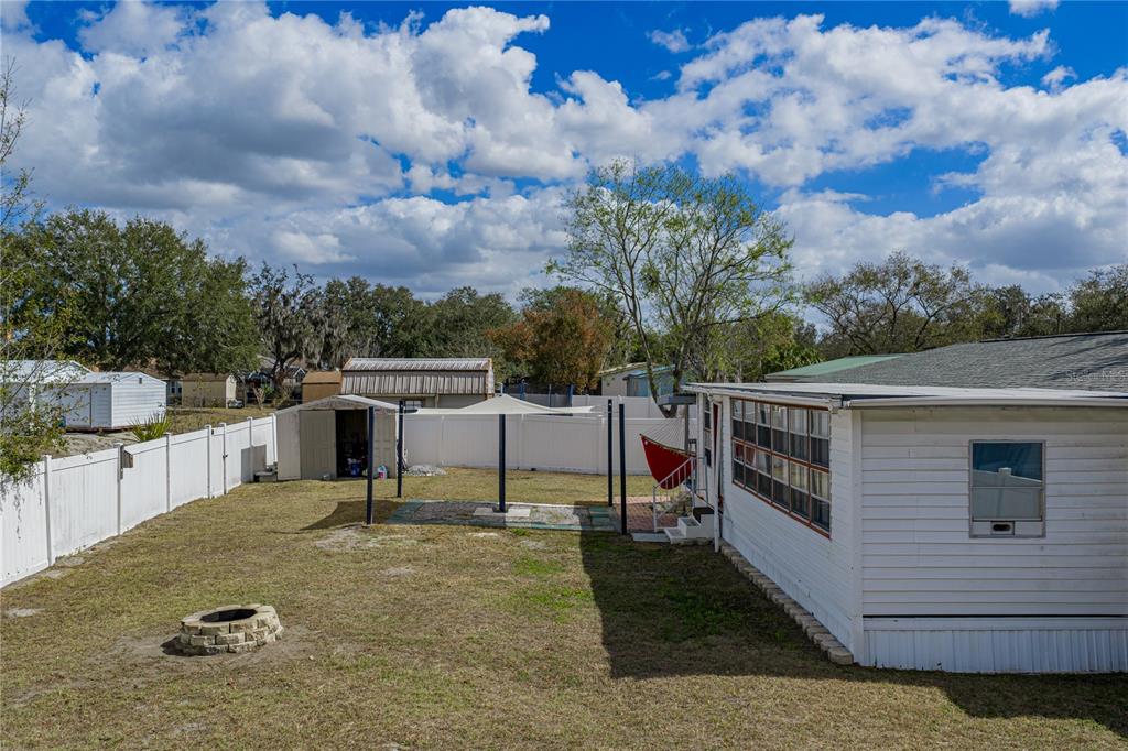 4695 Turner Road Mulberry, FL 33860 - Photo 46 of 51 a view of a white house with a yard