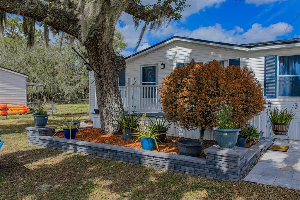 4695 Turner Road Mulberry, FL 33860 - Photo 5 of 51 a view of a house with backyard and sitting area