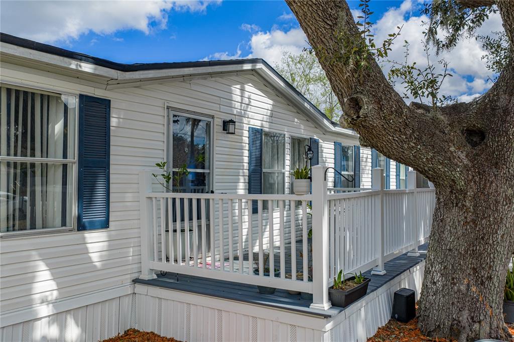 4695 Turner Road Mulberry, FL 33860 - Photo 7 of 51 a view of a house with a small yard and wooden fence