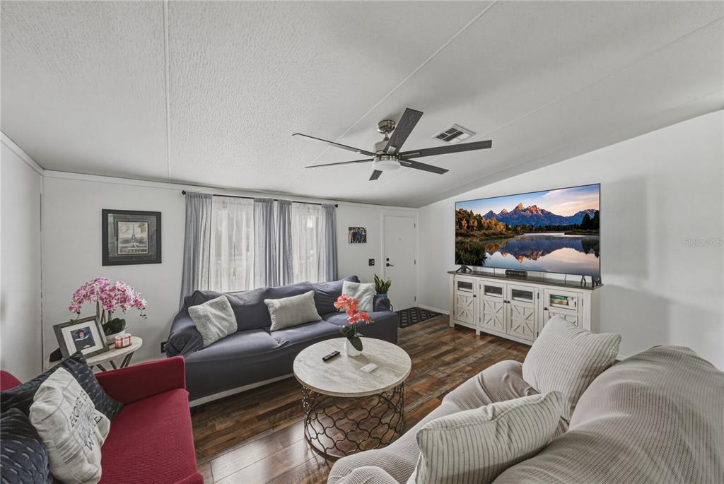 4695 Turner Road Mulberry, FL 33860 - Photo 8 of 51 a living room with furniture a window and a flat screen tv