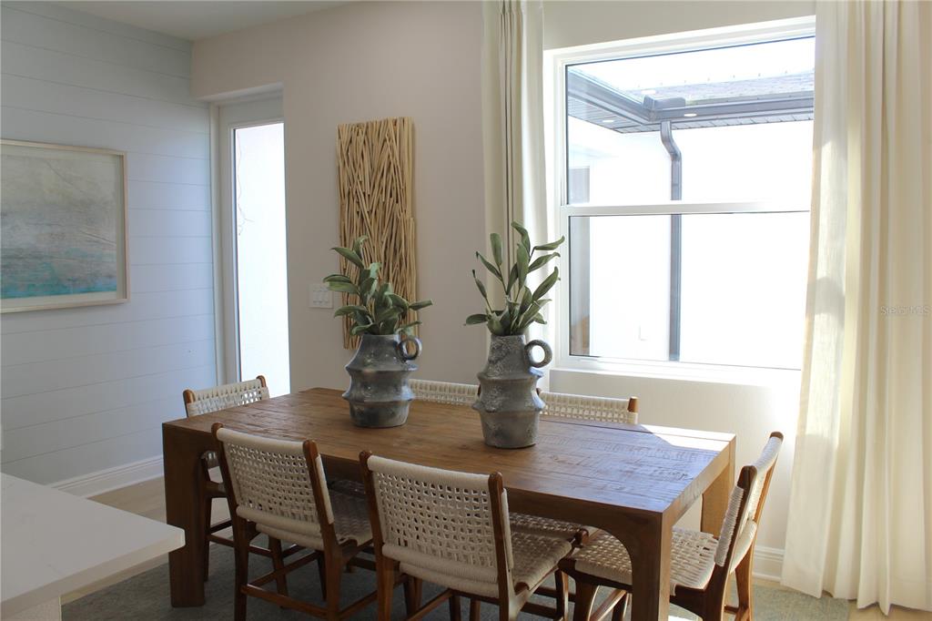 17730 Broadleaf Loop Venice, FL 34293 - Photo 7 of 15 a dining room with furniture and window