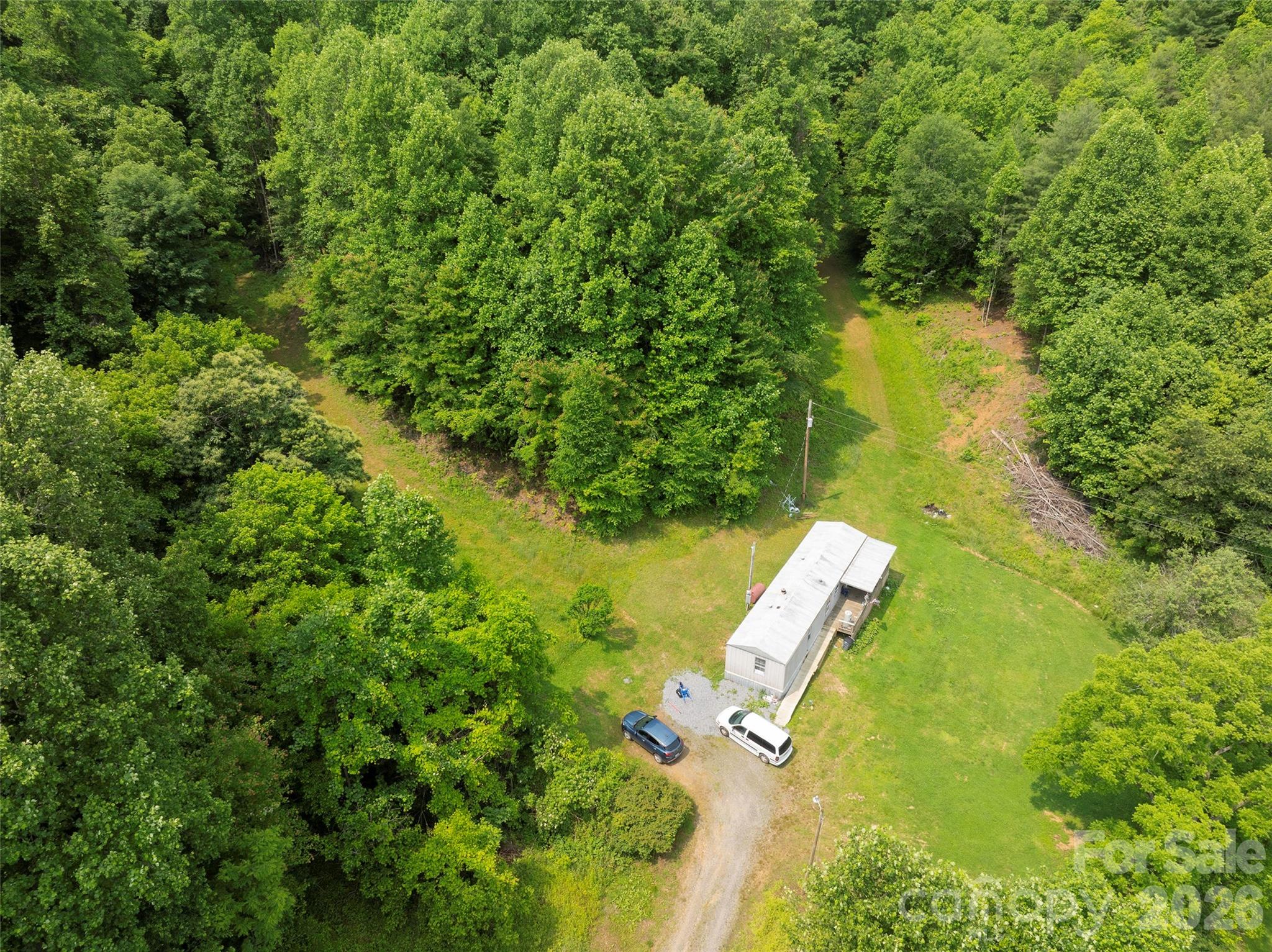 320 Board Tree Road Marshall, NC 28753 - Photo 7 of 13 an aerial view of residential houses with outdoor space and trees all around