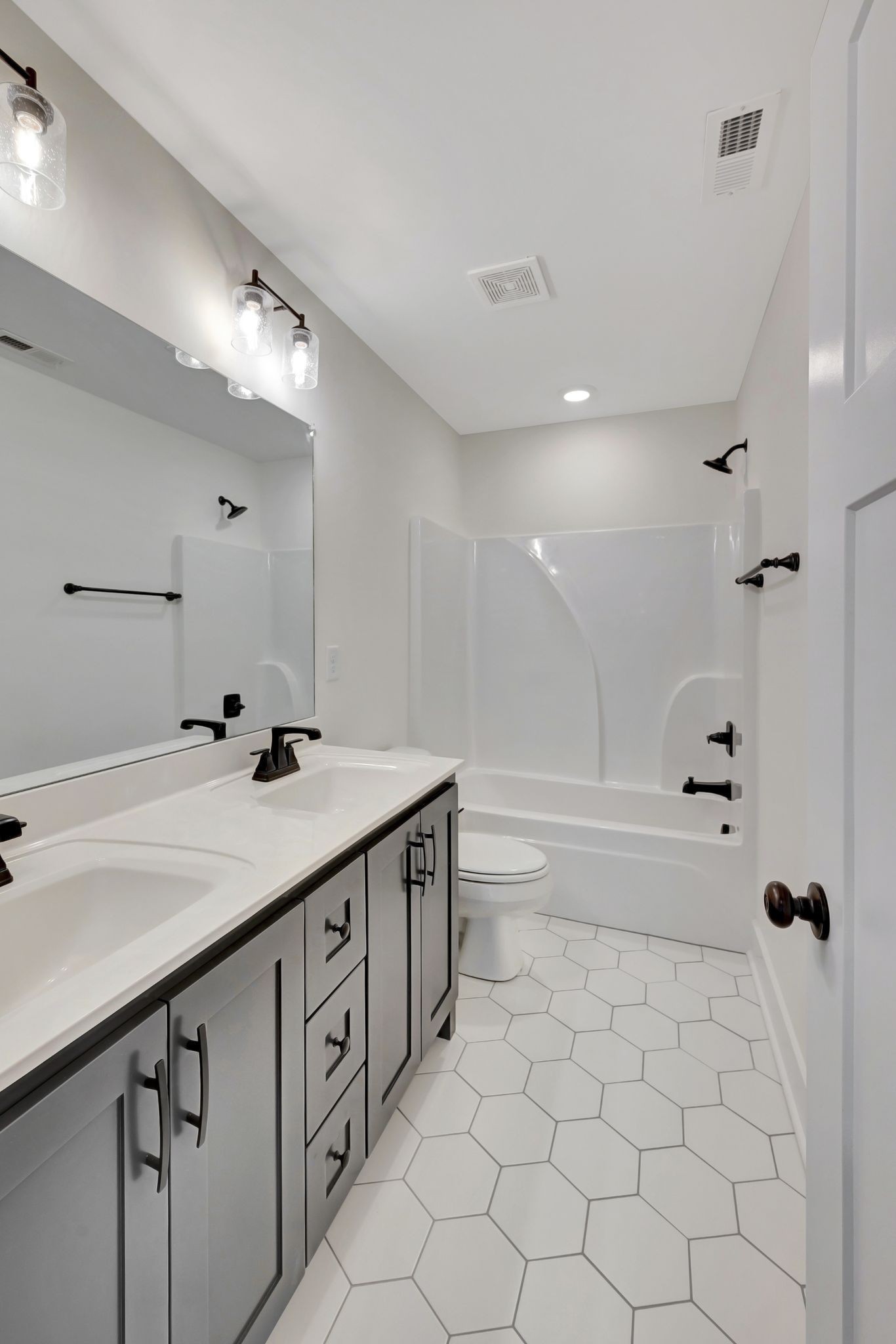 1038 Camden Trail Greenbrier, TN 37073 - Photo 26 of 36 a bathroom with a sink a toilet and shower