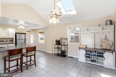 a dining room with furniture and chandelier
