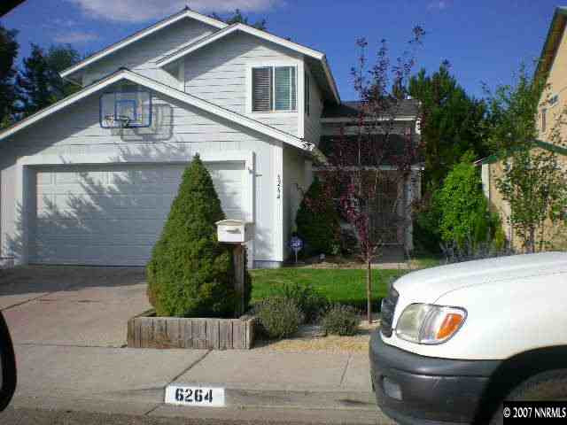 a view of house with outdoor space and garden