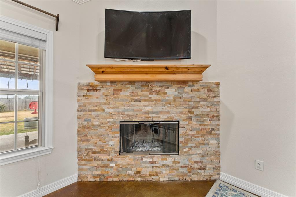 10514 Mesa Drive Waco, TX 76708 - Photo 15 of 39 Detailed view of a fireplace and baseboards