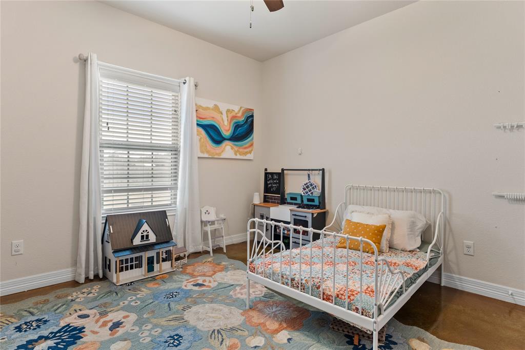 10514 Mesa Drive Waco, TX 76708 - Photo 23 of 39 Bedroom featuring baseboards and a ceiling fan