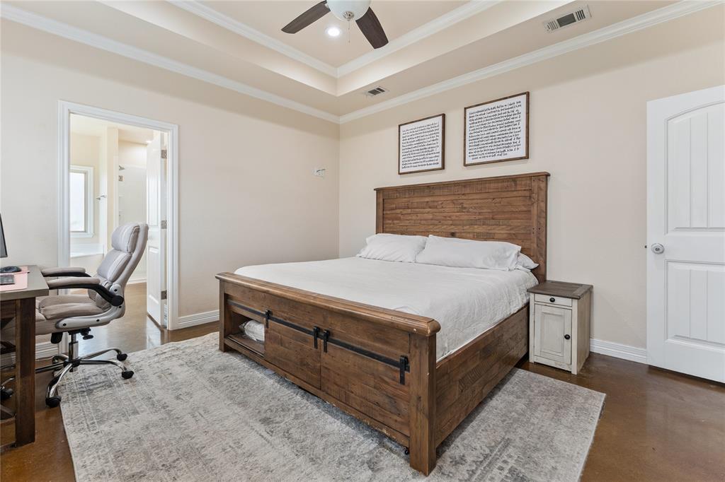 10514 Mesa Drive Waco, TX 76708 - Photo 28 of 39 Bedroom with concrete flooring, ceiling fan, ornamental molding, an office area, and a raised ceiling