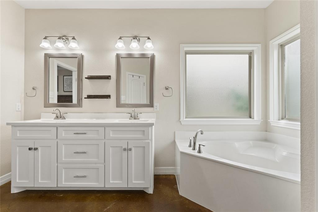 10514 Mesa Drive Waco, TX 76708 - Photo 30 of 39 Bathroom featuring double vanity, a bath, and concrete floors