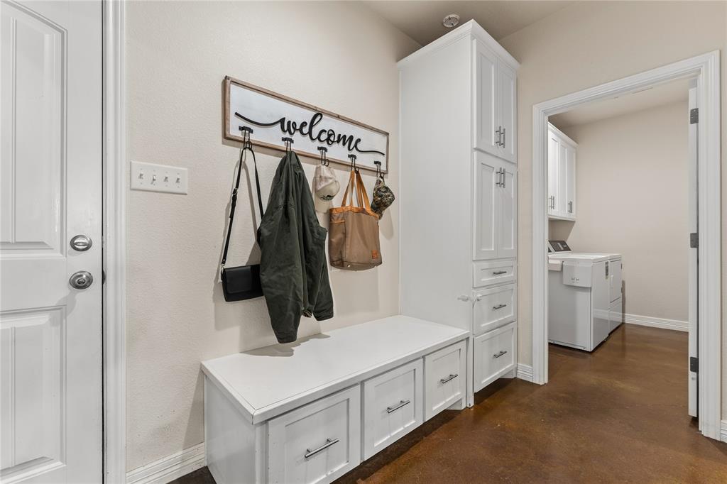 10514 Mesa Drive Waco, TX 76708 - Photo 4 of 39 Mudroom featuring concrete floors and independent washer and dryer