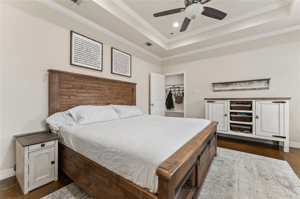 10514 Mesa Drive Waco, TX 76708 - Photo 6 of 37 Bedroom with crown molding, ceiling fan, a tray ceiling, and a spacious closet
