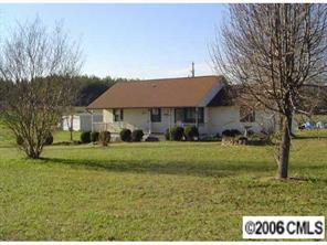2204 George Brown Road Crouse, NC 28033 - Photo 1 of 8 a front view of a house with a garden
