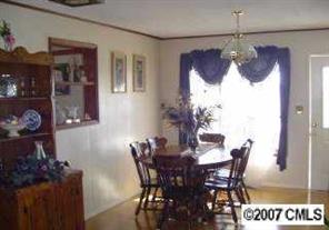 2204 George Brown Road Crouse, NC 28033 - Photo 6 of 8 a view of a dining room with furniture and chandelier