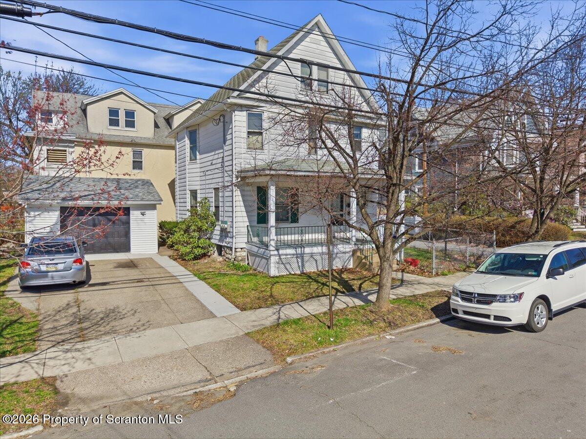 a view of a car parked in front of a building
