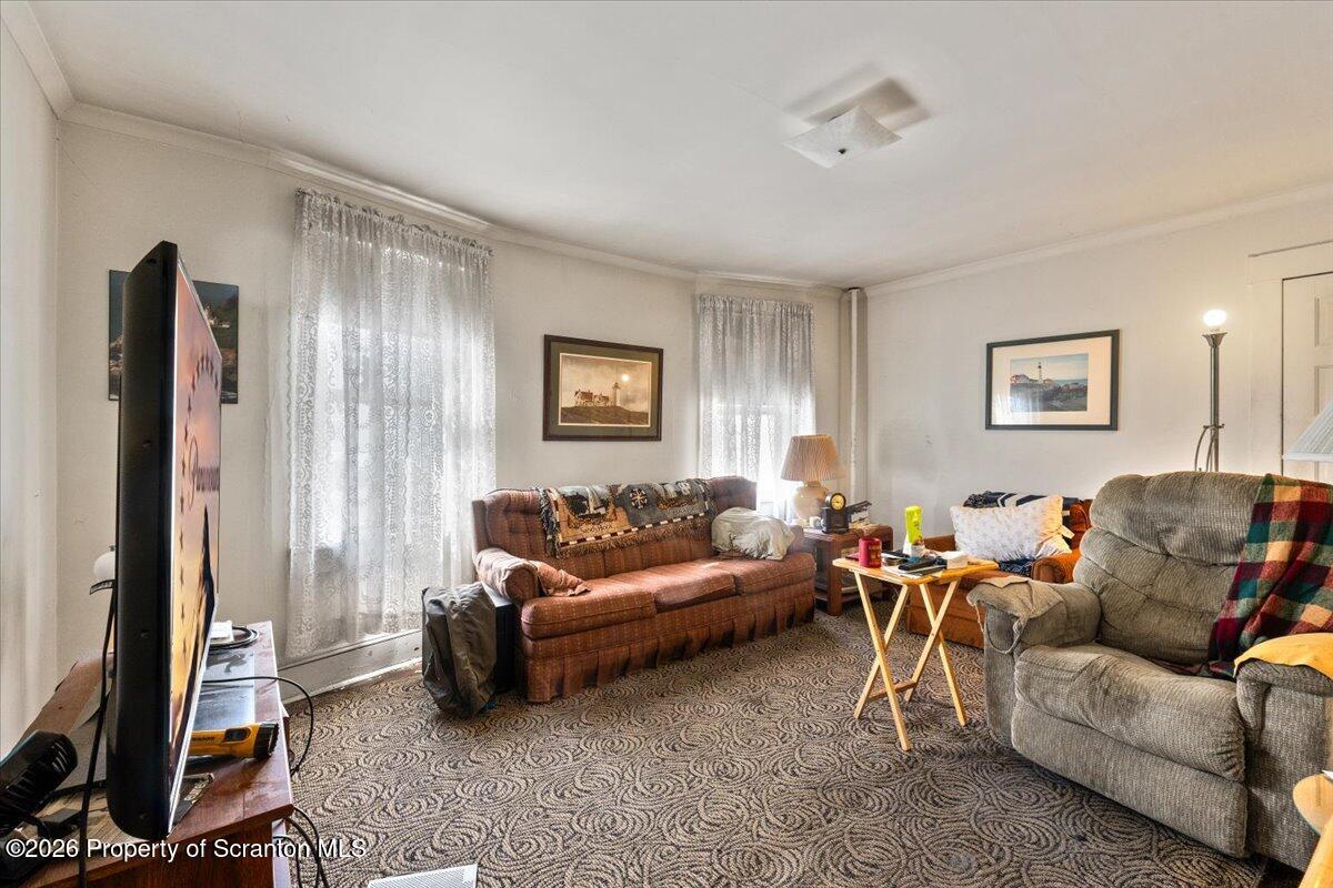 715 Alder Street Scranton, PA 18505 - Photo 22 of 38 a living room with furniture and a flat screen tv