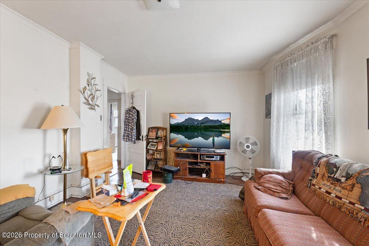 715 Alder Street Scranton, PA 18505 - Photo 23 of 38 a living room with furniture and a flat screen tv