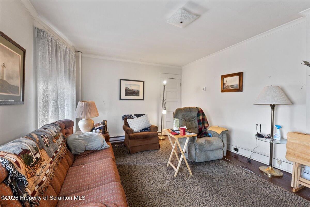 715 Alder Street Scranton, PA 18505 - Photo 24 of 38 a living room with furniture and a lamp