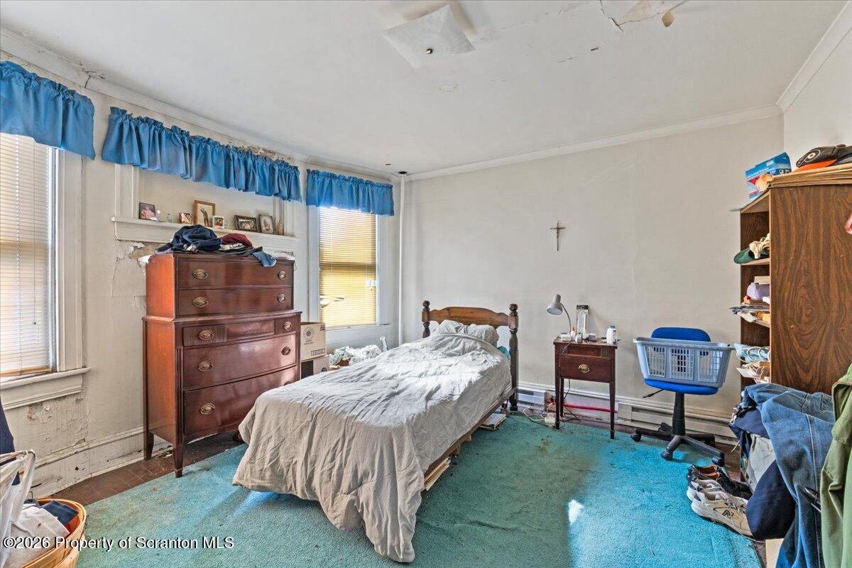 715 Alder Street Scranton, PA 18505 - Photo 30 of 38 a bedroom with a bed and a desk