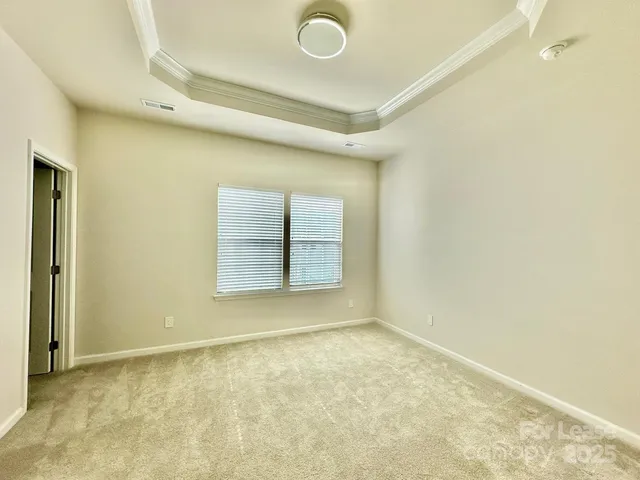 view of an empty room with a window