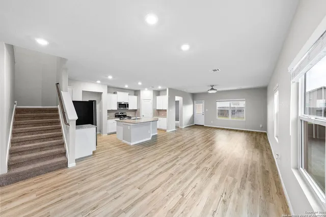 a bed room with a bed and a chair