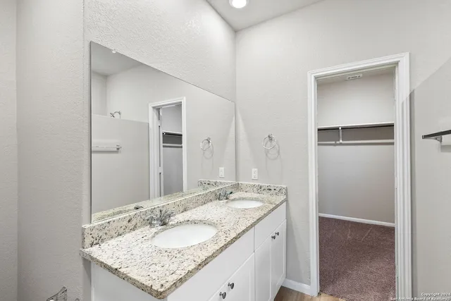 a bathroom with a bathtub and shower