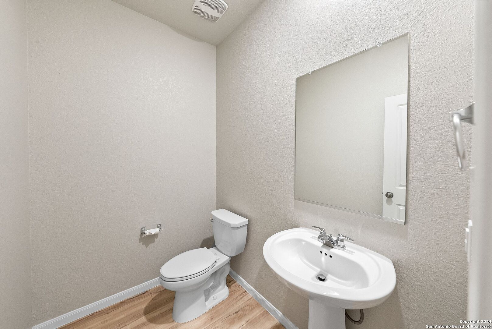 10535 Margarita Loop Converse, TX 78109 - Photo 27 of 51 a bathroom with a sink a toilet and mirror