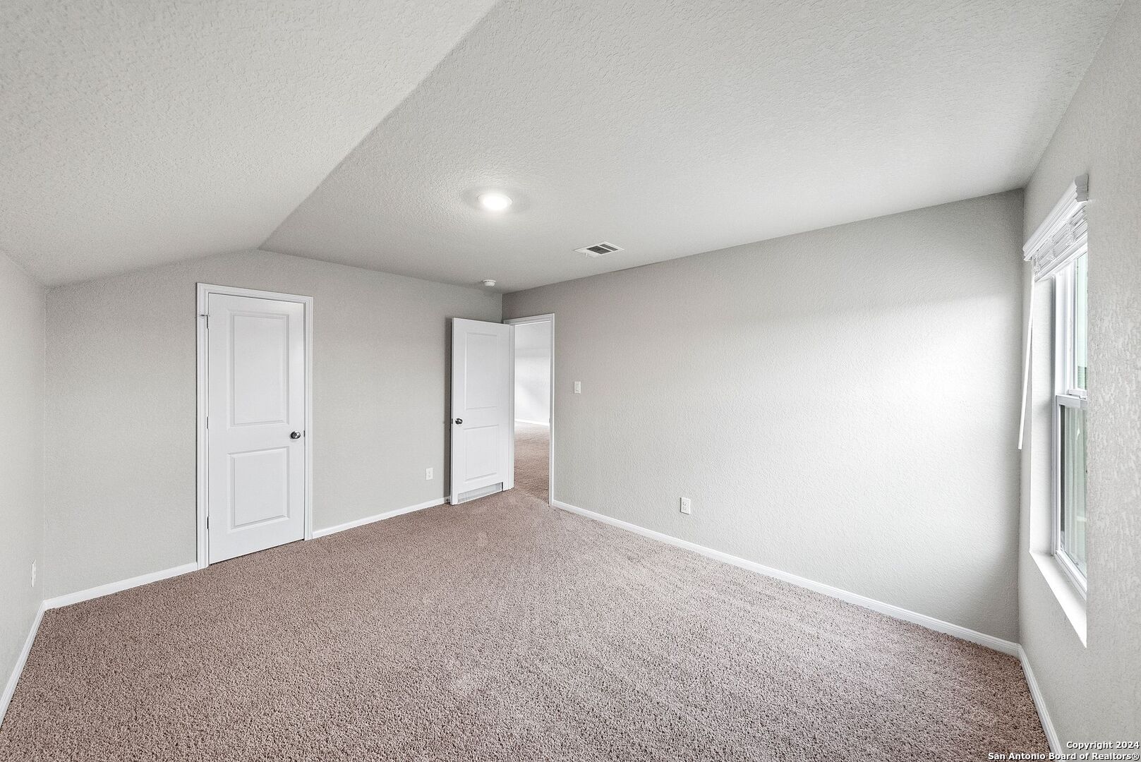 10535 Margarita Loop Converse, TX 78109 - Photo 35 of 51 a view of an empty room and a window
