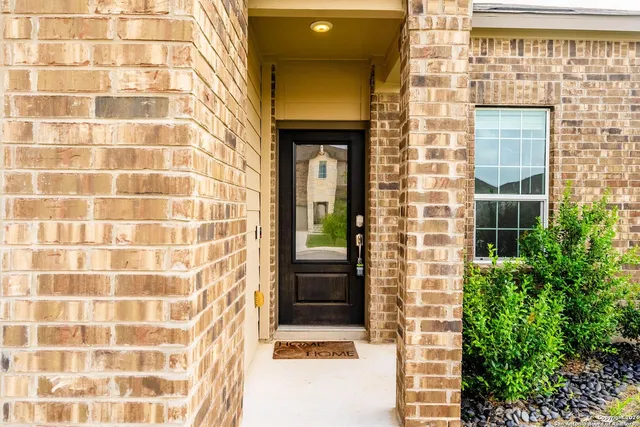 a view of a brick house with a window